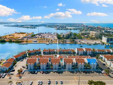 Stunning aerial view of waterfront condos, with easy access to the channel and ocean at 337 Rex Pl # G, Madeira Beach, FL 33708