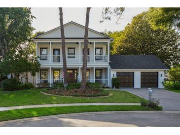Charming two-story home with a landscaped front yard and a two-car garage at 15704 Mifflin Ct, Tampa, FL 33647