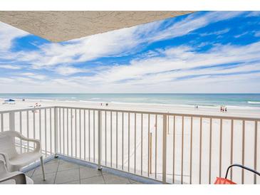 Beautiful beach view from the balcony with white metal railing and tile flooring, perfect for relaxing and enjoying the scenery at 18650 Gulf Blvd # 203, Indian Shores, FL 33785