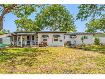 The backyard has a covered patio and mature landscaping and provides a tranquil outdoor retreat at 8444 8Th N Way, St Petersburg, FL 33702