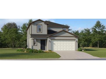 Charming two-story home with a well-maintained lawn, attached two-car garage, and traditional architectural style at 2288 Blue Grosbeak Pl, Wimauma, FL 33598