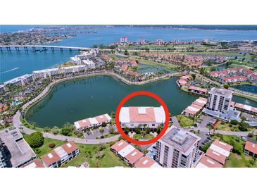 Beautiful waterfront condos with terracotta roofing and lush landscaping overlooking the calm waters at 6290 Bahia Del Mar Cir # 12, St Petersburg, FL 33715