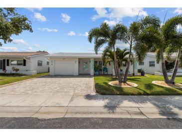 Charming single-story home with beautiful landscaping and a brick driveway at 9743 36Th N Way # 4, Pinellas Park, FL 33782