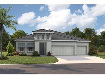 Charming single-story home featuring a three-car garage, gray color palette, and a beautifully landscaped front yard at 10321 Surrey Rose Dr, San Antonio, FL 33576