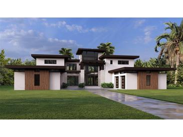 Stunning modern home with a meticulously manicured lawn and a striking architectural design at 19207 Gunn Hwy, Odessa, FL 33556