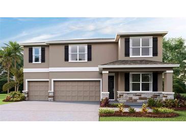 Charming two-story home boasts a neutral exterior, three-car garage, stone accents, and a cozy covered front porch at 10669 Bridgegate Heights Loop, San Antonio, FL 33576