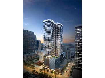 Stunning exterior of a high-rise building in an urban setting with modern architectural design and illuminated details at 520 N Tampa St # 4201, Tampa, FL 33602