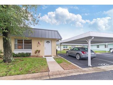 Charming single-story home with a covered carport and well-maintained front lawn at 11723 Boynton Ln # 1, New Port Richey, FL 34654