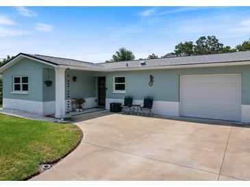 Charming single-story home with a two-toned exterior and well-maintained lawn, perfect for curb appeal at 460 4Th S St, Safety Harbor, FL 34695
