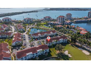 Panoramic aerial view featuring water, bridge, and community with ponds and parking at 6085 Bahia Del Mar Blvd # 106, St Petersburg, FL 33715