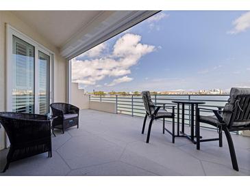Outdoor patio area with furniture and a beautiful water view at 7922 Sailboat Key S Blvd # 105, South Pasadena, FL 33707