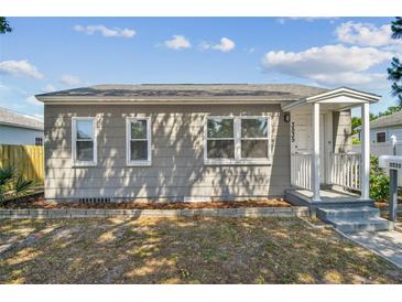 Charming single-story home featuring a cozy front porch and well-maintained landscaping at 3535 16Th N St, St Petersburg, FL 33704