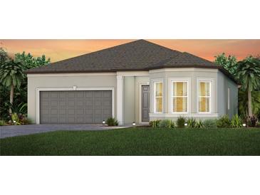 Charming single-story home featuring a gray garage door, well-maintained lawn, and inviting front entrance at 11443 Shoreline Trl, Parrish, FL 34219