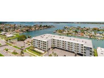 Stunning aerial view of waterfront condo building with beautiful ocean views at 400 Island Way # 1709, Clearwater Beach, FL 33767