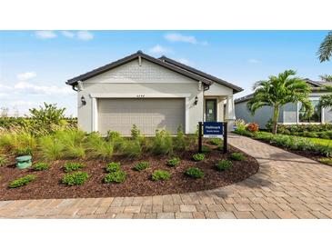 Charming single-story home with manicured landscaping and neutral color palette at 4527 Gardner St, Bradenton, FL 34210
