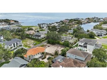 Desirable waterfront lot in a neighborhood with stunning bay views surrounded by luxury homes and lush landscaping at 5029 W Dickens Ave, Tampa, FL 33629