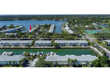 Scenic aerial view of waterfront condos with boat docks on a sunny day at 5075 Starfish Se Dr # A, St Petersburg, FL 33705