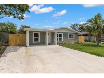 Inviting single-story home featuring a covered entry and a spacious driveway at 6620 Del Prado Ter, New Port Richey, FL 34652