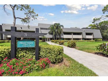 Prestwick Lodge 20 featuring lush landscaping and a well-maintained exterior at 36750 Us 19 N Hwy # 3104, Palm Harbor, FL 34684