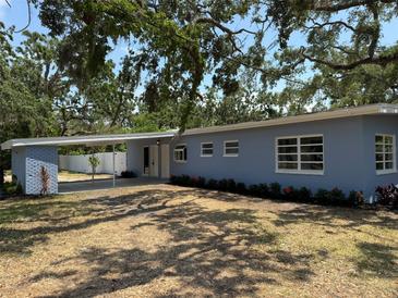 Charming single-story home with a carport, freshly painted exterior, and well-maintained landscaping at 3000 58Th S Ave, St Petersburg, FL 33712
