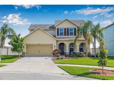 Charming two-story home with landscaped yard and attached two-car garage at 11917 Greenchop Pl, Riverview, FL 33579
