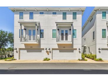 Charming townhome featuring a modern design, private balconies, and convenient garage access at 4757 Legacy Park Dr, Tampa, FL 33611