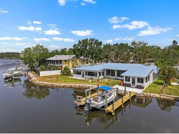Beautiful waterfront home featuring a private boat dock and stunning water views from nearly every room at 100 18Th Nw St, Ruskin, FL 33570