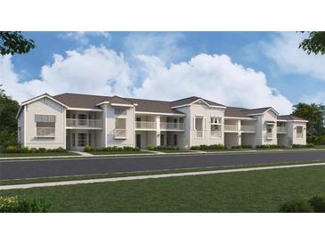 Beautiful two-story condo building with private balconies and manicured landscaping at 17470 Opal Sand Dr # 103, Venice, FL 34293