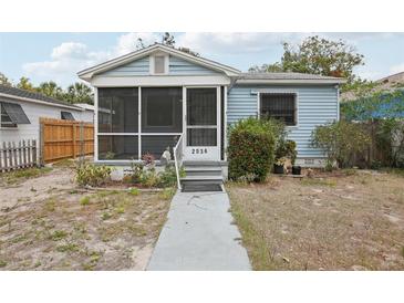 Charming bungalow featuring a screened porch and light blue siding at 2034 Upton S Ct, St Petersburg, FL 33712