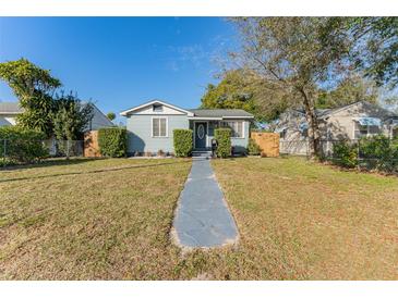 Charming single-story home featuring a well-maintained lawn, tidy landscaping, and a welcoming front entrance at 2035 29Th N Ave, St Petersburg, FL 33713