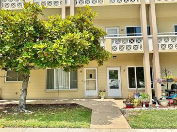 Charming condo exterior featuring lush landscaping and a welcoming entrance at 2360 Irish Ln # 16, Clearwater, FL 33763