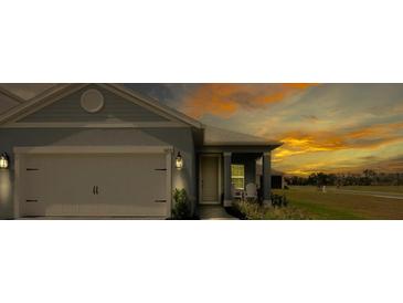 Charming single-Gathering home showcasing a well-manicured lawn and an attached two-car garage at 10153 Spruce River Way, Parrish, FL 34219