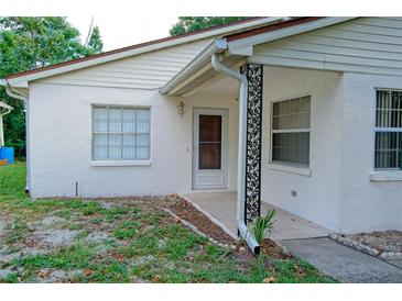 Cozy single-story home with a textured stucco exterior and decorative support post at 1262 Jeffords St, Clearwater, FL 33756