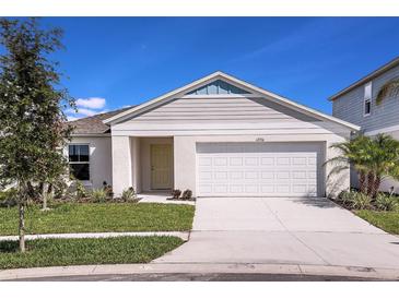 Charming single-Gathering home with well-manicured lawn and attached two-car garage at 14815 Summer Branch Dr, Lithia, FL 33547