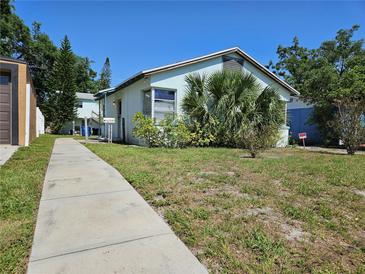 Charming single-story home with a walkway and front yard at 2510 Queen S St, St Petersburg, FL 33712