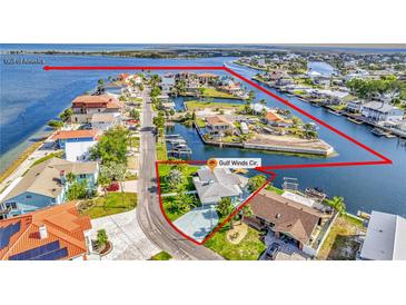 Aerial view of waterfront home with Gulf access, surrounded by canals at 3181 Gulf Winds Cir, Hernando Beach, FL 34607