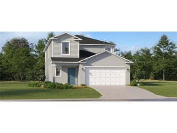 Charming two-story home with a two-car garage, manicured lawn and a welcoming blue front door at 11753 Brae Way, Dade City, FL 33525