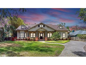Charming home featuring a landscaped front yard and inviting entrance at 2621 Stearns Rd, Valrico, FL 33596