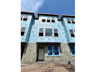 New townhouse exterior showcasing a modern design with large windows and durable WeatherMate Plus house wrap at 479 31St N Way, St Petersburg, FL 33713