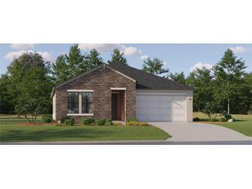 Charming single-story home featuring a stone facade, attached two-car garage, and well-maintained landscaping at 9406 Gladsome Dr, Land O Lakes, FL 34637