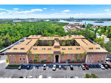 Expansive aerial view of the condo complex near lush greenery and waterways at 12760 Indian Rocks Rd # 578, Largo, FL 33774