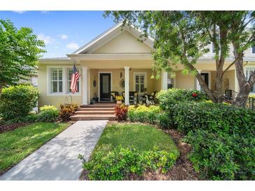 Charming home featuring a cozy front porch, lovely landscaping, and manicured lawn at 3543 Gamble St, New Port Richey, FL 34655