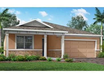 Charming single-story home featuring a blend of stone and stucco accents, and a well-manicured lawn at 5012 124Th E Ave, Parrish, FL 34219