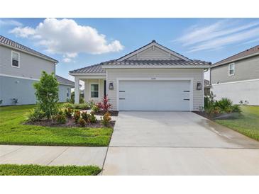 Charming single-story home boasting a well-manicured lawn and a spacious driveway with ample parking at 6281 Dry Tortugas Dr, Sarasota, FL 34241