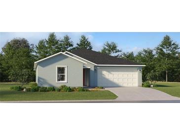 Charming one-story home with a two-car garage, manicured lawn and beautiful shrubbery at 15091 Zircon Red Dr, Wimauma, FL 33598