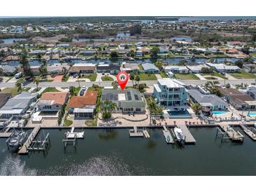 Waterfront home with boat dock access and lush landscaping at 4055 Floramar Ter, New Port Richey, FL 34652
