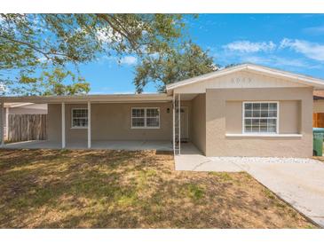 Charming single-story home with a welcoming covered porch and a well-maintained front yard at 9043 108Th Ave, Seminole, FL 33777