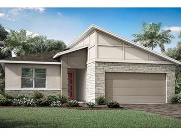 Beautiful new home featuring stone accents, modern design, and a two-car garage at 5120 125Th E Ave, Parrish, FL 34219