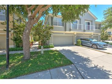 Charming townhome featuring an attached garage, balcony, and well-maintained landscaping in a desirable community at 6782 Breezy Palm Dr, Riverview, FL 33578