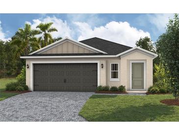 Charming single-Gathering home with a well-manicured lawn and a two-car garage at 37155 Sagemoor Dr, Zephyrhills, FL 33541